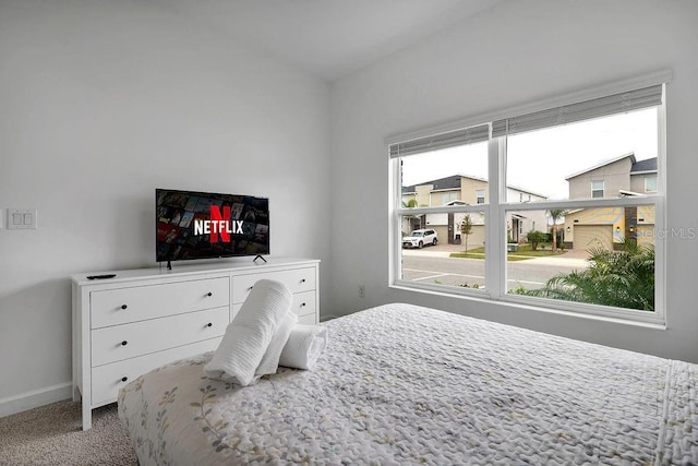 bedroom with carpet and baseboards