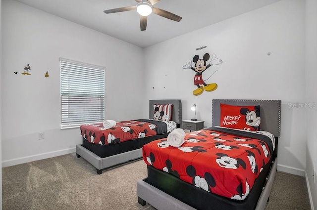 carpeted bedroom featuring a ceiling fan and baseboards