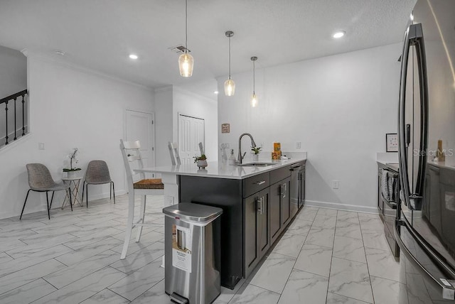 kitchen featuring marble finish floor, a sink, freestanding refrigerator, light countertops, and baseboards