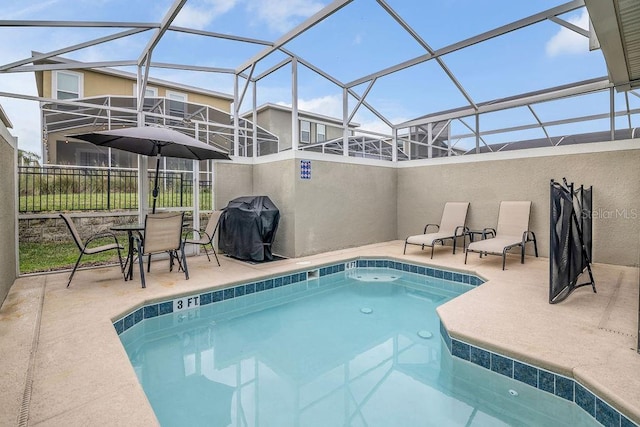 view of pool with a patio, area for grilling, and a lanai