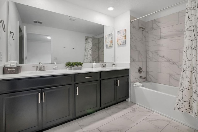 bathroom with a sink, visible vents, marble finish floor, and shower / bath combination with curtain