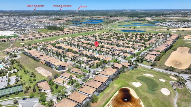 aerial view with a water view, a residential view, and golf course view