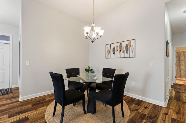 dining space with lofted ceiling, baseboards, a chandelier, and dark wood-style flooring