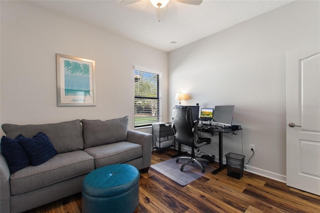 office area featuring ceiling fan, dark wood-style flooring, and baseboards