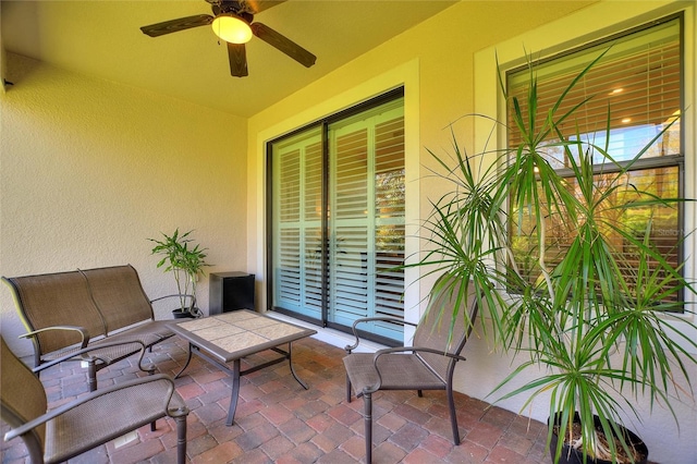 view of patio featuring a ceiling fan