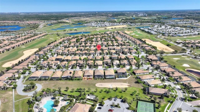 bird's eye view with golf course view, a water view, and a residential view