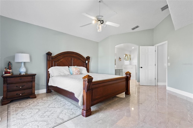 bedroom with arched walkways, visible vents, lofted ceiling, and baseboards