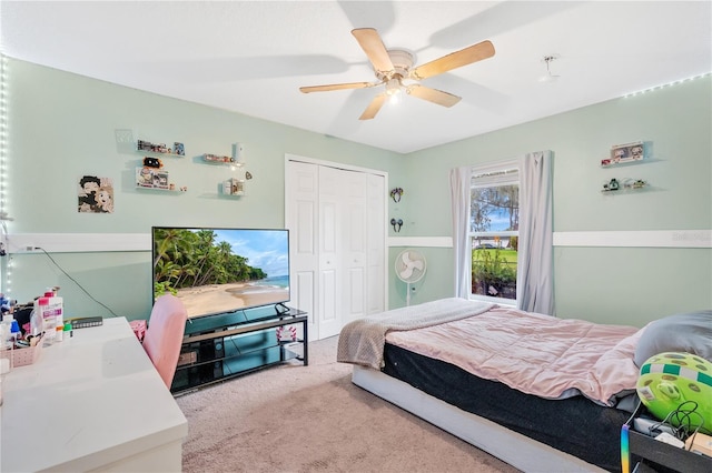 bedroom with a closet, carpet, and a ceiling fan