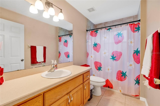 bathroom featuring curtained shower, visible vents, toilet, vanity, and tile patterned floors