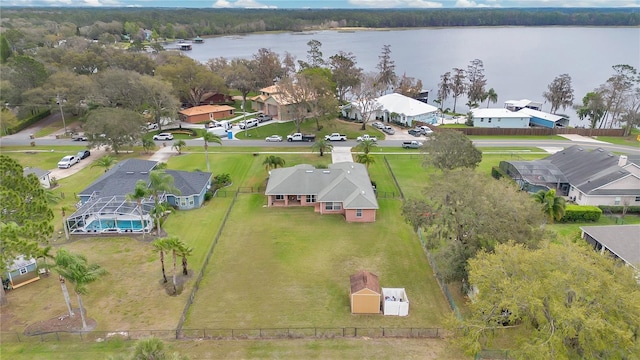 birds eye view of property featuring a water view and a residential view