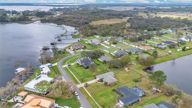 aerial view featuring a water view and a residential view