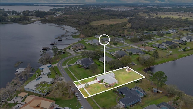 aerial view featuring a water view and a residential view