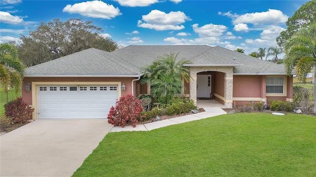 single story home with roof with shingles, an attached garage, a front lawn, and stucco siding