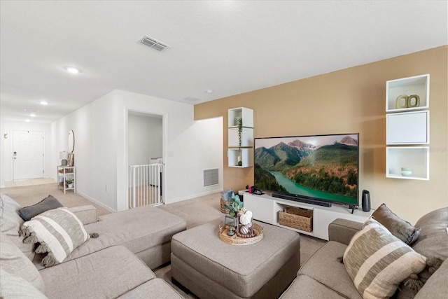 carpeted living room featuring recessed lighting, visible vents, and baseboards