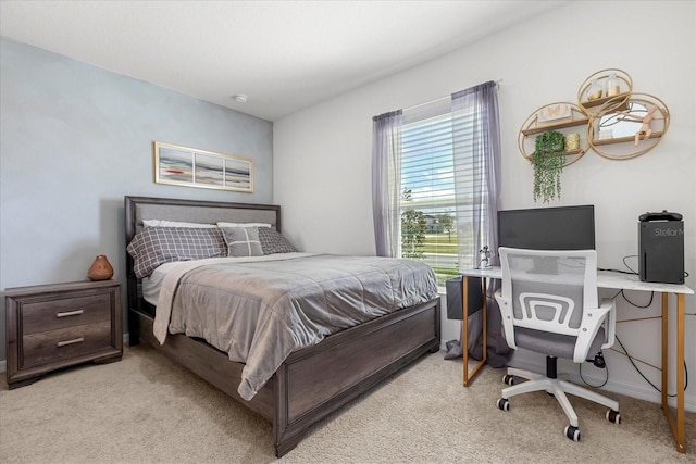 bedroom featuring light carpet