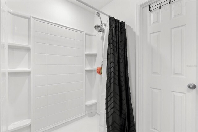 bathroom with a shower with shower curtain