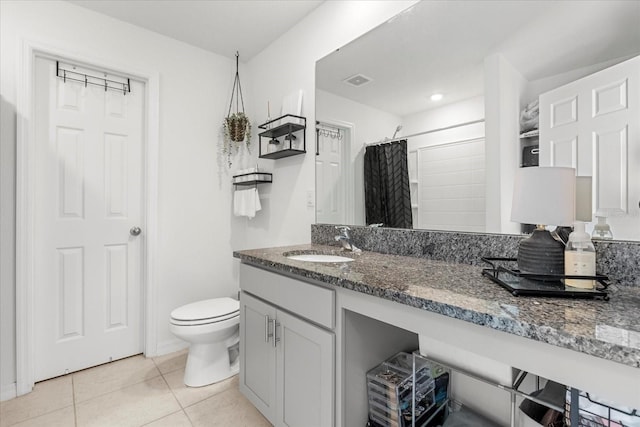 bathroom featuring visible vents, toilet, curtained shower, tile patterned flooring, and vanity