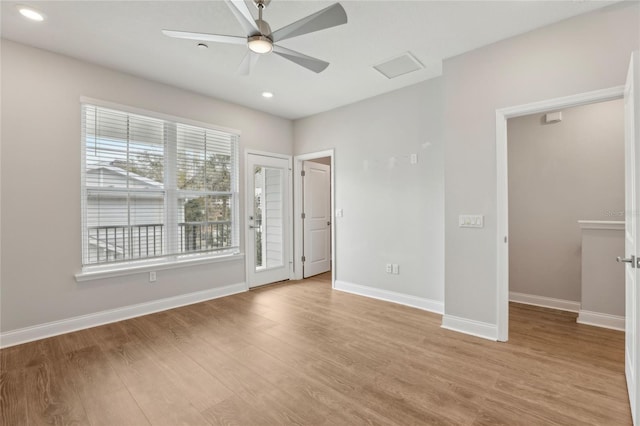 unfurnished bedroom featuring recessed lighting, light wood-type flooring, and baseboards