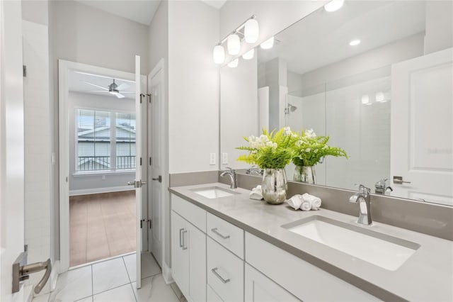 full bathroom featuring a sink, double vanity, recessed lighting, and a shower stall