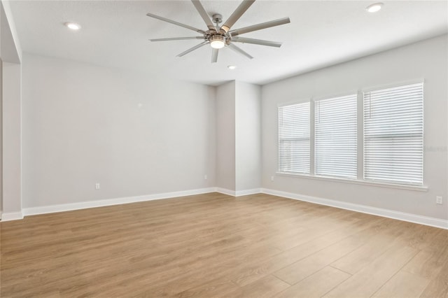 unfurnished room featuring recessed lighting, baseboards, ceiling fan, and light wood finished floors