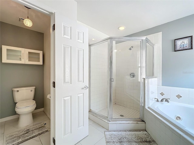 bathroom featuring a garden tub, a shower stall, toilet, and tile patterned floors