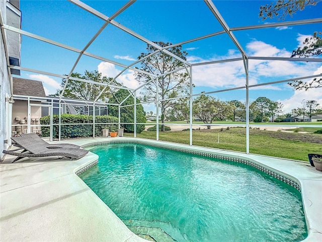 outdoor pool with glass enclosure, a patio, and a lawn