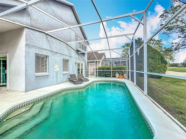 pool with a patio and a lanai