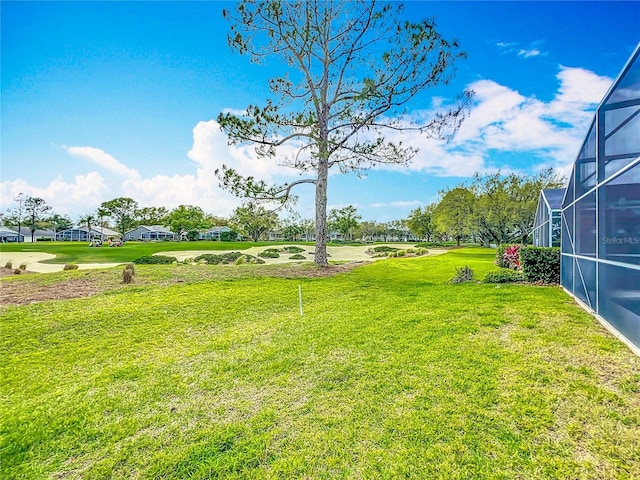 view of yard featuring a lanai