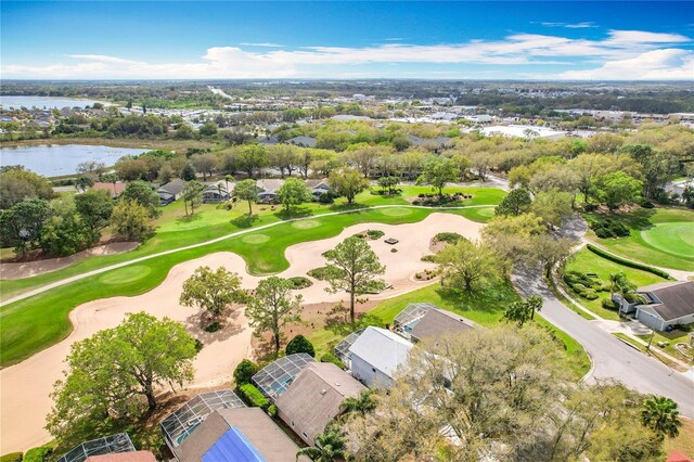 bird's eye view featuring view of golf course and a water view