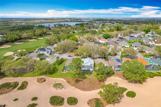 aerial view featuring a residential view, a water view, and golf course view