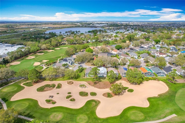 bird's eye view with view of golf course and a water view