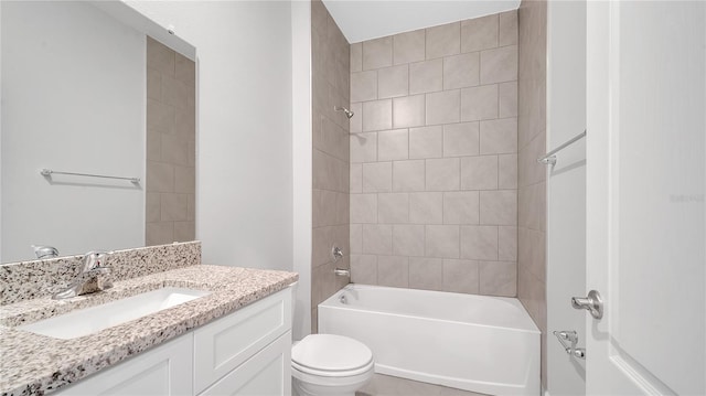 bathroom with bathing tub / shower combination, toilet, and vanity