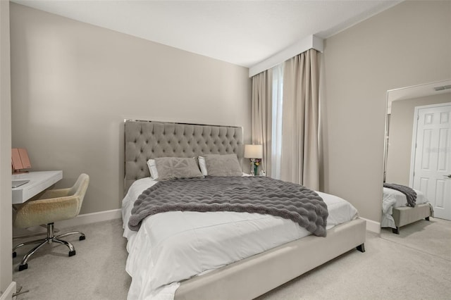 carpeted bedroom featuring visible vents and baseboards