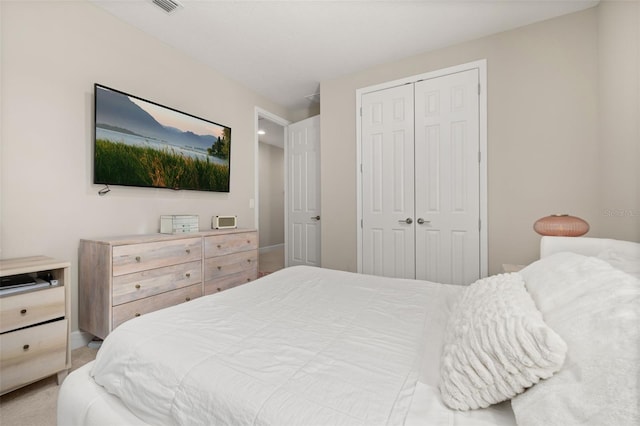 carpeted bedroom with a closet