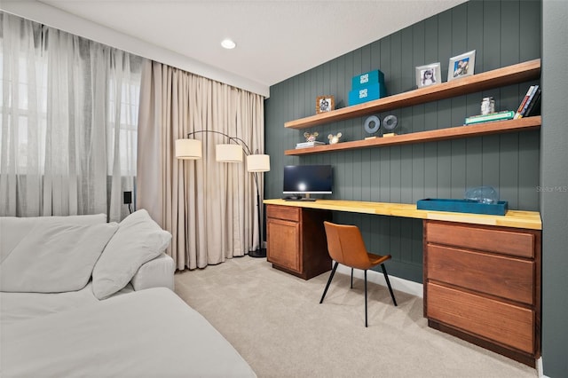 office with recessed lighting, light colored carpet, and built in study area