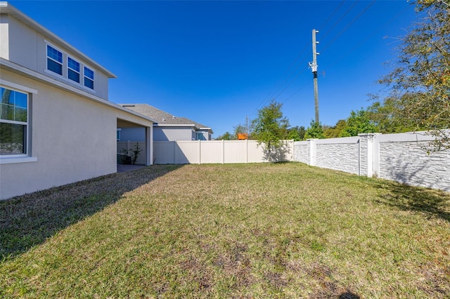 view of yard featuring a fenced backyard