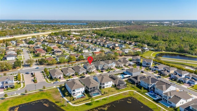 aerial view with a water view and a residential view