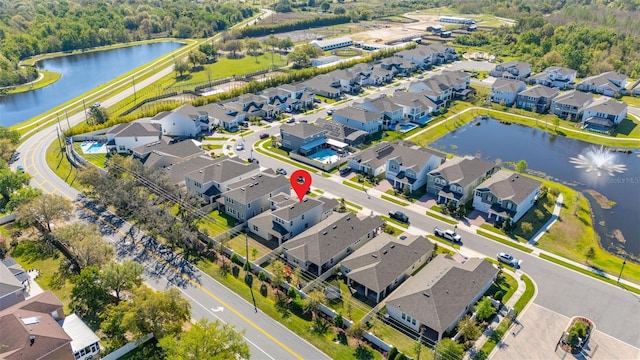 birds eye view of property featuring a residential view and a water view