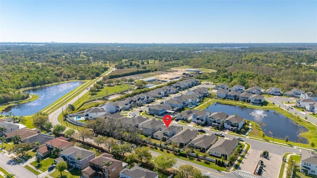 birds eye view of property with a residential view and a water view