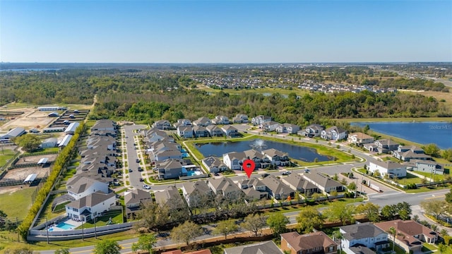 bird's eye view featuring a residential view and a water view