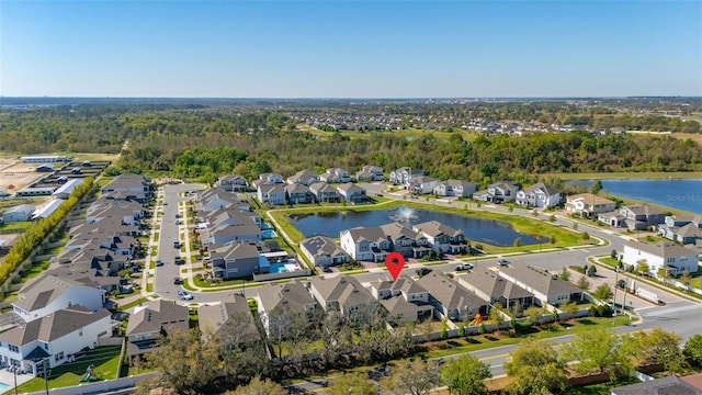 birds eye view of property featuring a residential view and a water view