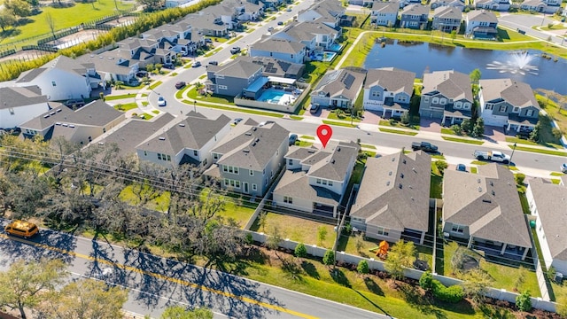 aerial view with a residential view and a water view