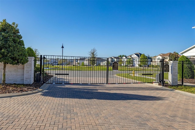 view of gate featuring a residential view