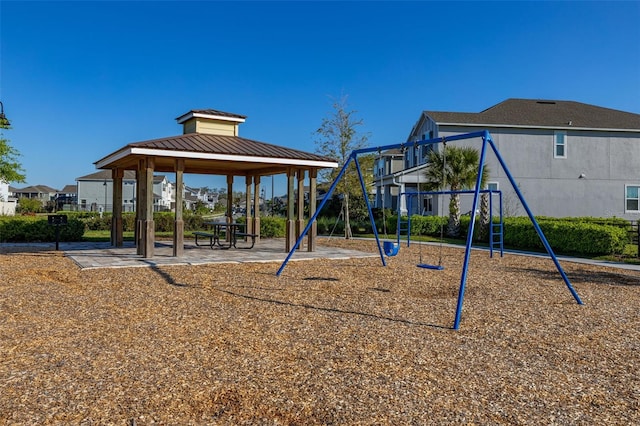 communal playground featuring a gazebo and a residential view