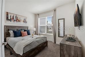 carpeted bedroom with baseboards