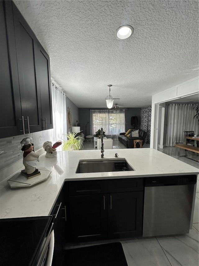 kitchen with a peninsula, range with electric stovetop, a sink, dark cabinetry, and dishwasher