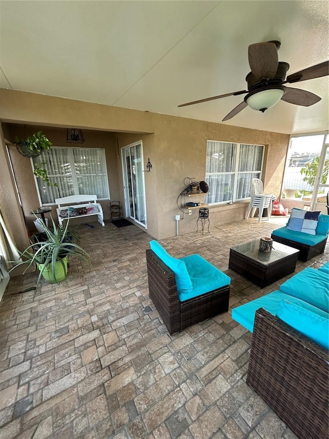 view of patio / terrace with outdoor lounge area and a ceiling fan