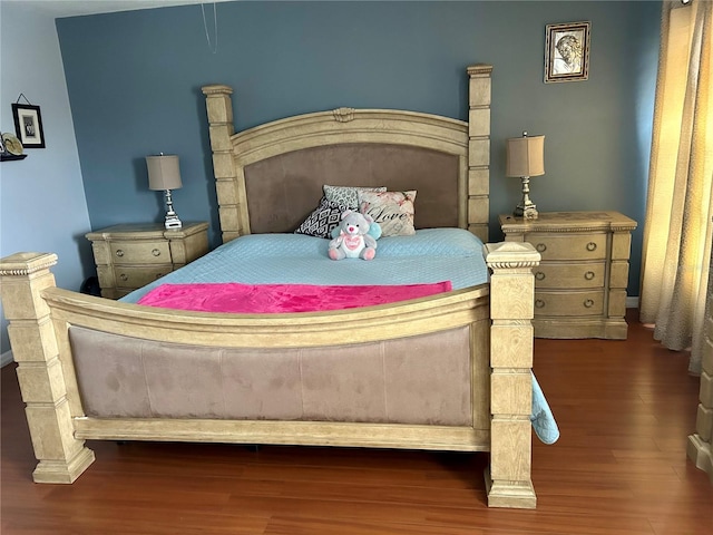 bedroom featuring wood finished floors