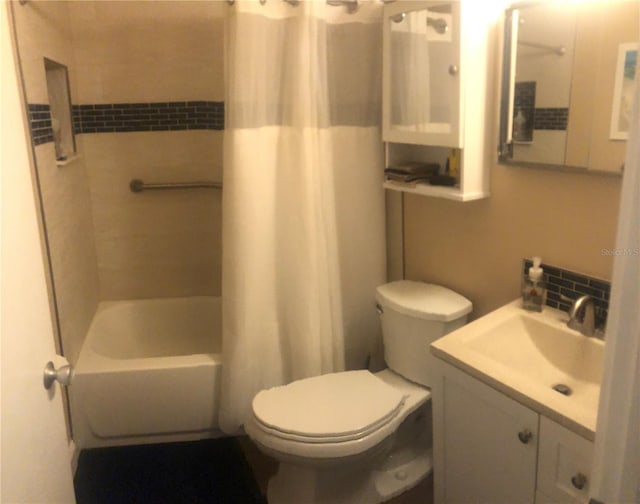 full bathroom with toilet, tasteful backsplash, shower / bath combination with curtain, and vanity