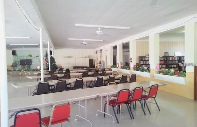 interior space featuring concrete flooring and a ceiling fan